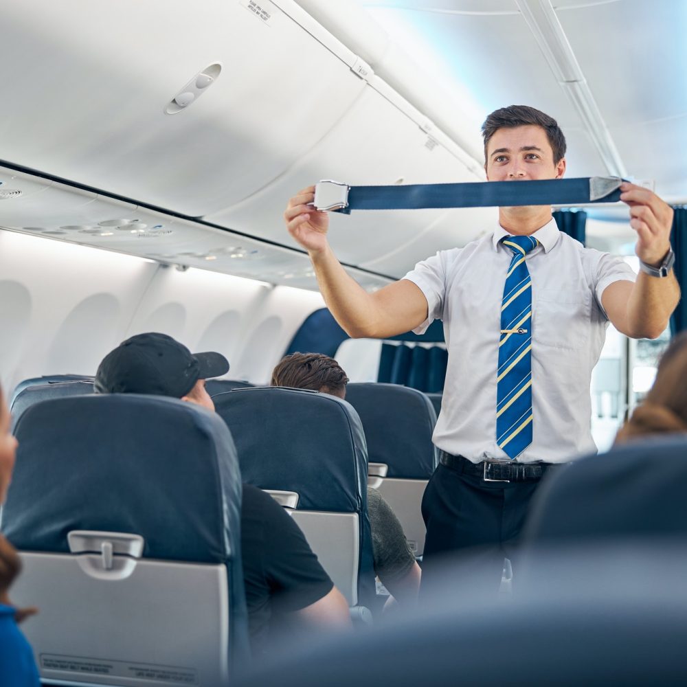 handsome-steward-training-safety-prior-procedures-to-flight-take-off.jpg